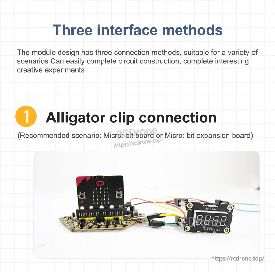 Alligator-clip wiring example with micro:bit expansion board connected to the 4-digit digital tube display