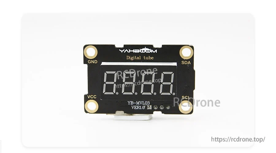 Front view of the digital tube module with labeled pins VCC, GND, SDA, and SCL around the display