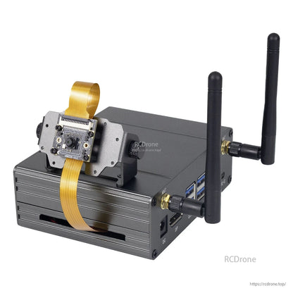 Camera module mounted on bracket with ribbon cable looped over case, dual antennas attached