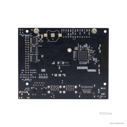 Back view of bare PCB showing printed labels, test pads, and mounting holes