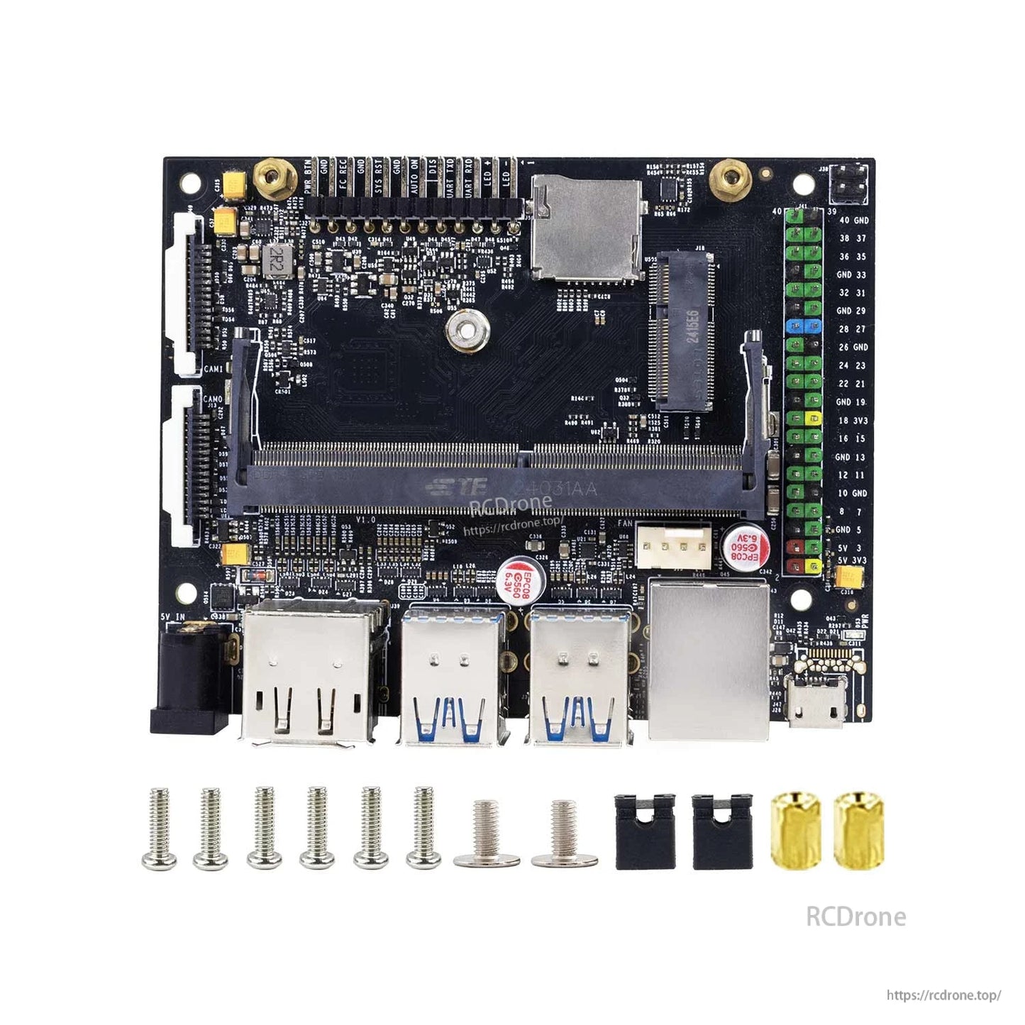 Jetson Nano B01 carrier board with included screws, standoffs and jumper caps laid out below