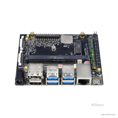 Angled top view highlighting M.2 slot area and right-side 40-pin GPIO header beside I/O ports