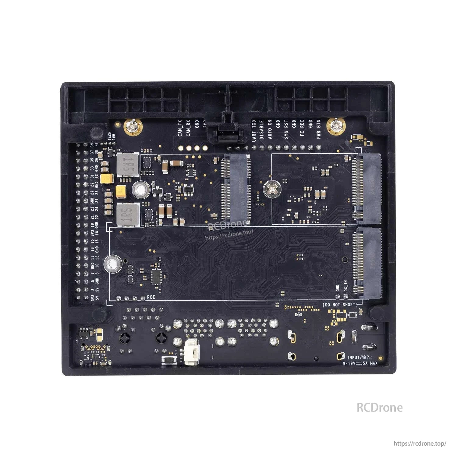 Bottom side of carrier board PCB showing solder points, headers, and connector footprints
