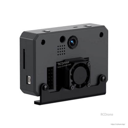 Back view with cooling fan bracket attached, showing lens, vent grille, and connector header