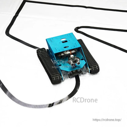 Tracked smart car driving on black line course on white canvas tracking map