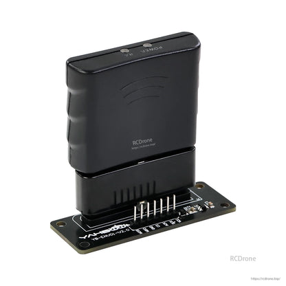 Receiver module seated on adapter board, angled view showing power and link buttons on top