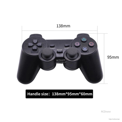 PS2-style wireless gamepad dimensions diagram, 138mm wide and 95mm tall controller
