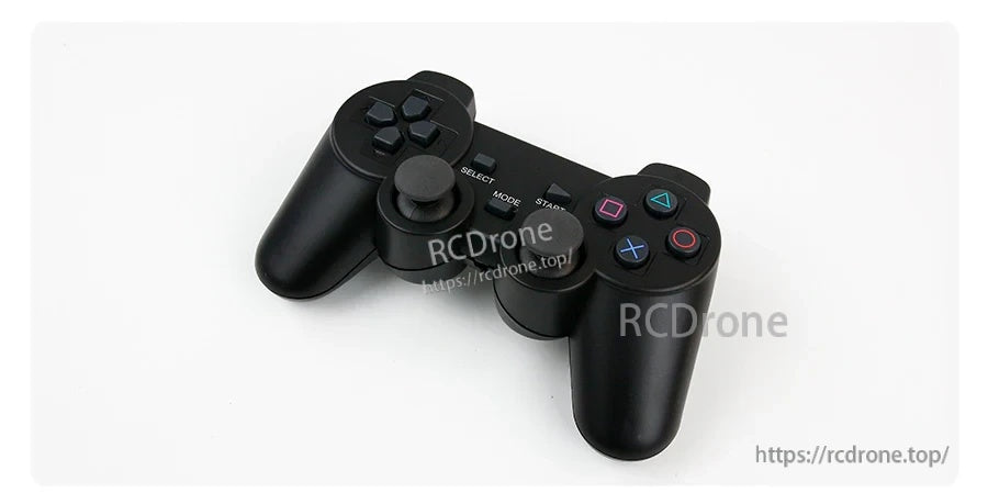 Angled view of PS2-style wireless handle controller showing buttons, D-pad, and grips
