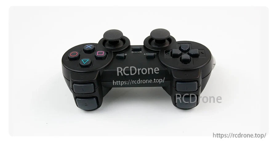 Top/side view of PS2-style wireless controller showing shoulder buttons and joystick placement