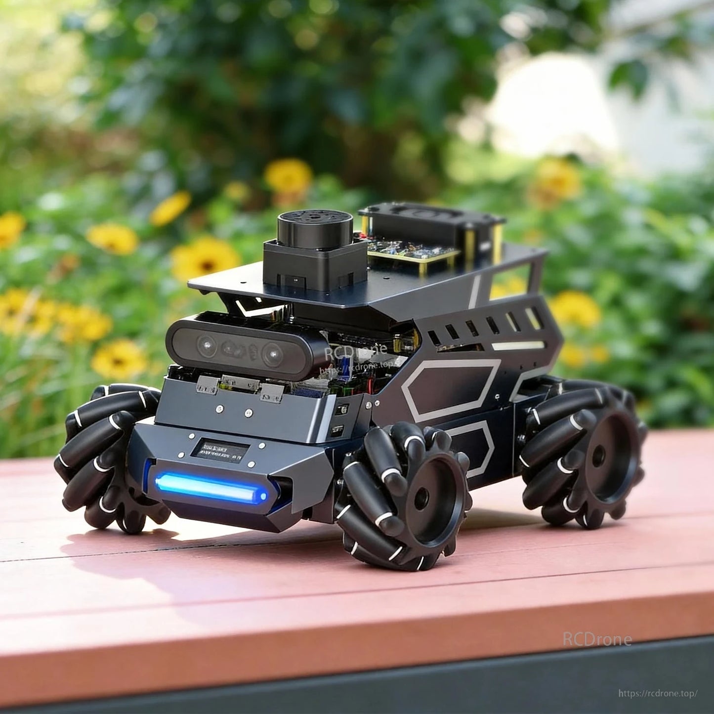 ROSMASTER M3 robot outdoors on a bench, showing Mecanum wheels, front sensor bar, and top mounting plate