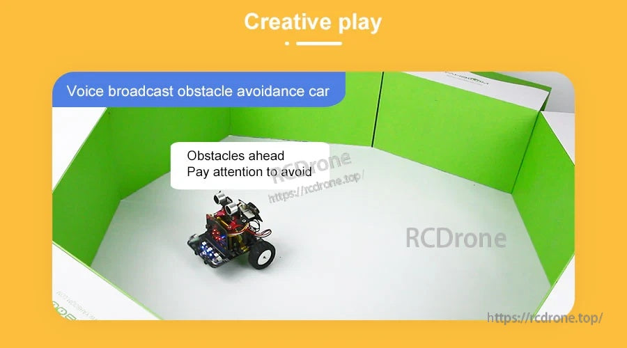 Small voice broadcast obstacle avoidance robot car on a white tabletop with wheels and sensor module