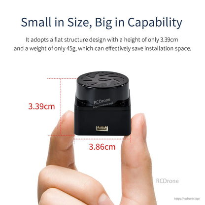 Compact size view of T-MINI Plus lidar held between fingers with 3.39 cm height and 3.86 cm width marked