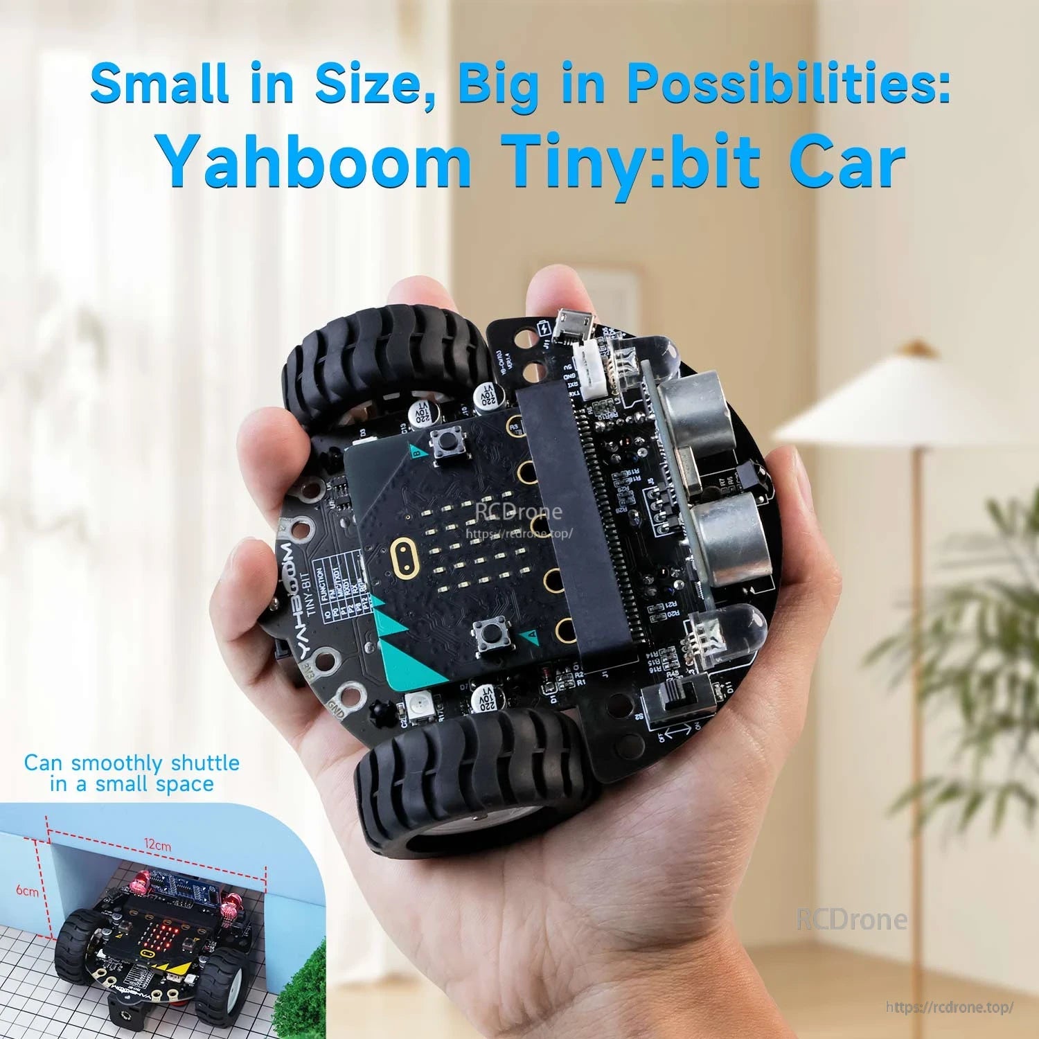 Tiny:bit car shown in hand for size, compact two-wheel robot chassis with sensor board on top