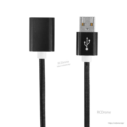 Straight-on view of USB-A female adapter end and USB-A male plug end on braided cable