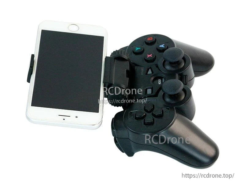 Wireless PS2-style controller mounted with phone clamp holder, angled view showing grips and buttons