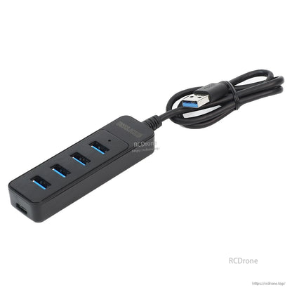 USB 3.0 4-port hub with cable tied, showing top panel and Type-C power input end