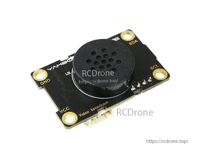 Close-up angled view highlighting I2C pin pads (SDA/SCL) and onboard speaker on the Yahboom board