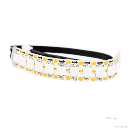 Close-up of flexible WS2812 RGB LED strip section with solder pads and black lead wire
