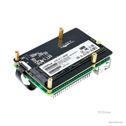 Installed M.2 SSD on adapter stacked on Raspberry Pi via FPC ribbon and brass standoffs, side angle