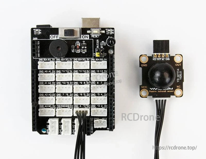 YB-HMV14 PIR sensor connected to a microcontroller expansion board via cable, showing typical hookup layout