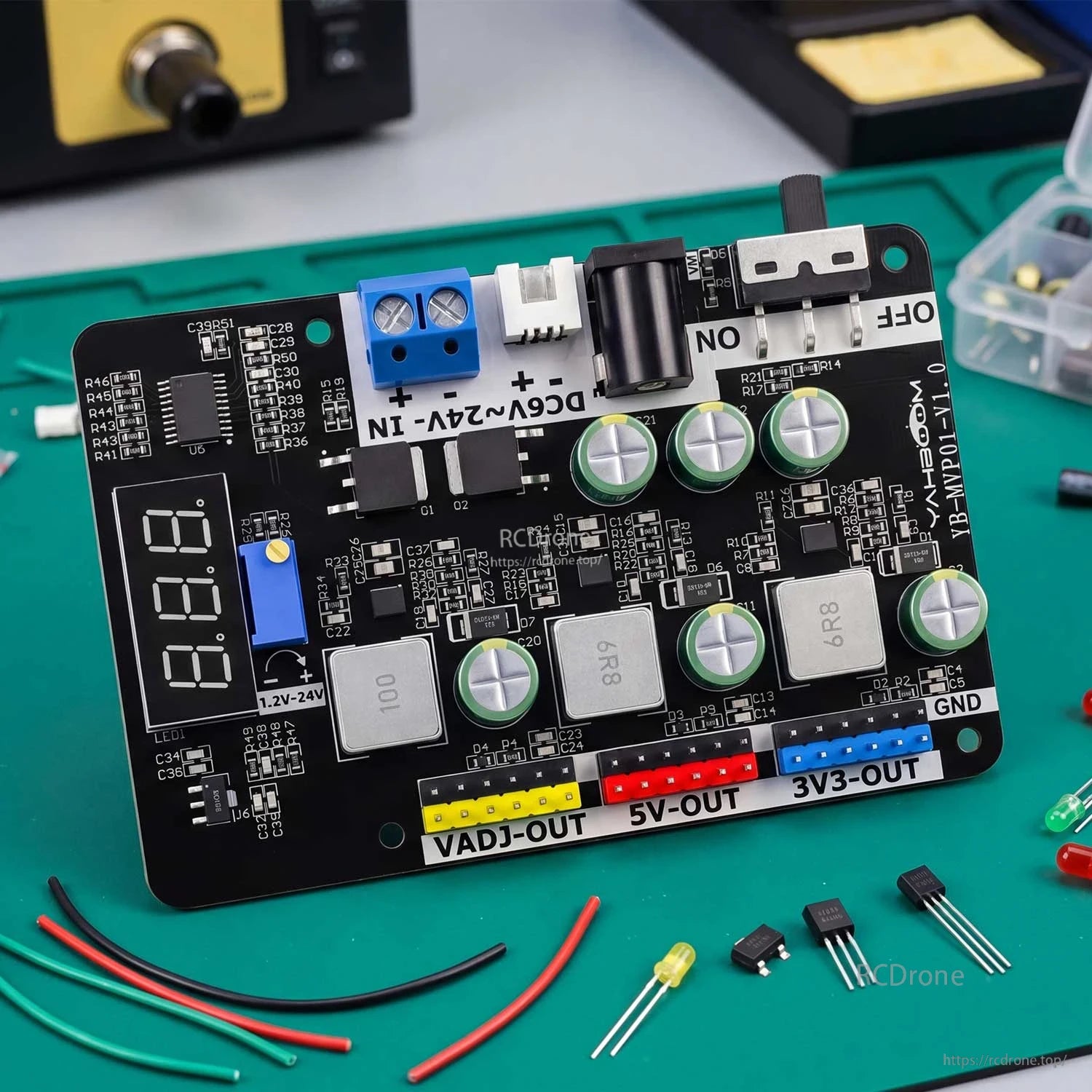 Module shown on electronics workbench with wires and components, highlighting real-world DIY power setup
