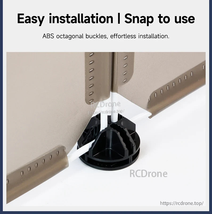 Close-up of ABS octagonal snap buckle connector joining two sandbox panels for quick assembly