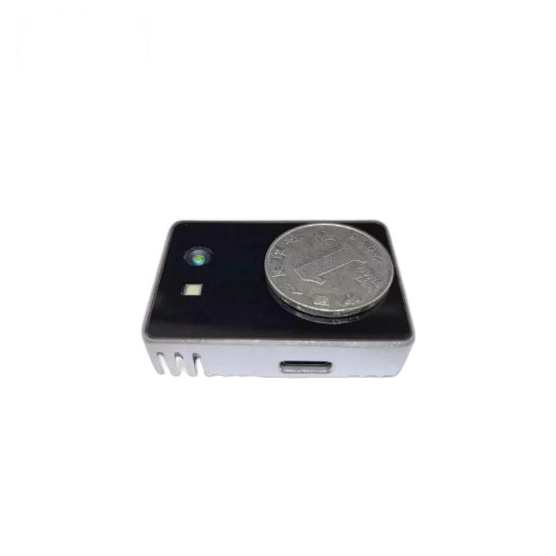 Yunshis CS20 LiDAR depth sensor with coin for size reference, USB-C port visible on the front edge