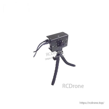 Yunshis DME660 Camera module on mini tripod with connected cables, angled front view