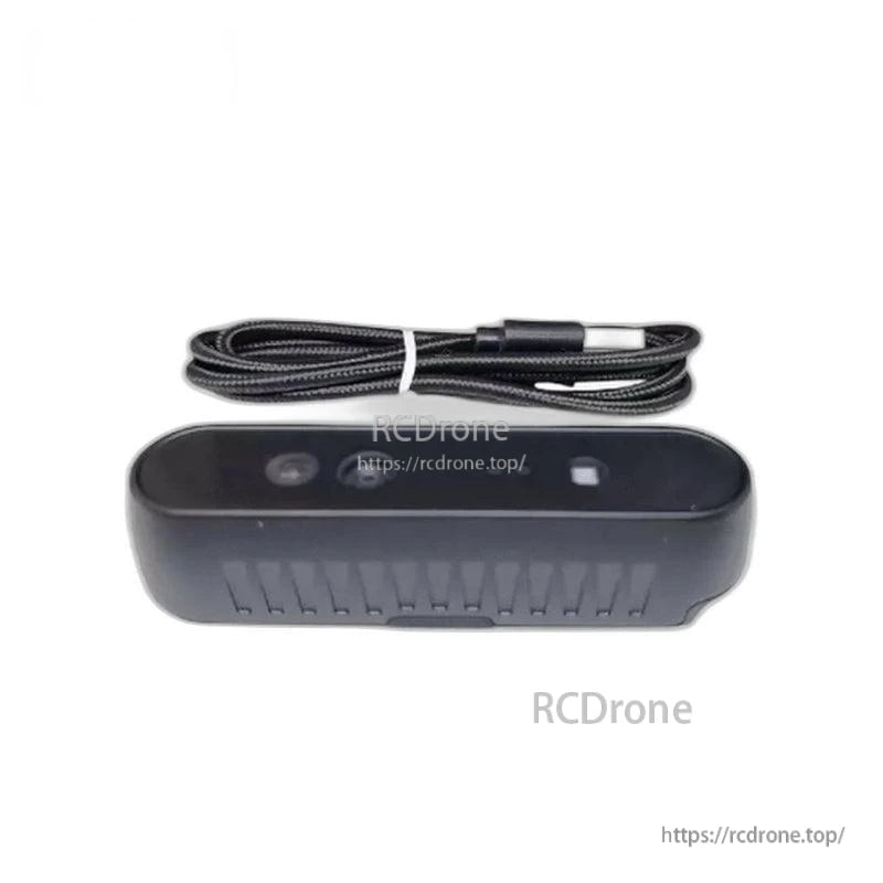 RGB-D depth camera with included USB cable, shown above device for package contents overview