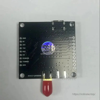 Back of ZED-F9P RTK GNSS receiver board with labeled UART/SPI pins, mounting holes, and SMA antenna connector