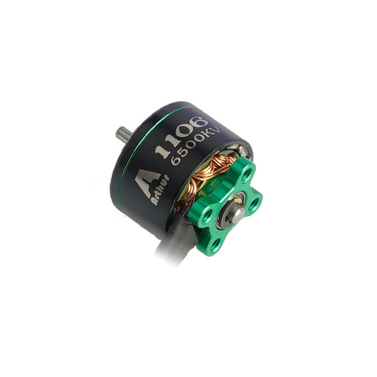 Flashhobby Arthur A1106 6500KV brushless motor with green mount, visible copper windings and shaft