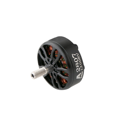 Flashhobby A2807 brushless FPV motor with black vented bell, visible copper windings, and threaded shaft