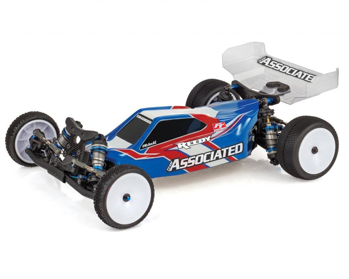 Team Associated RC10B7.1 1/10 2WD electric buggy kit with blue/red body, white wheels and rear wing