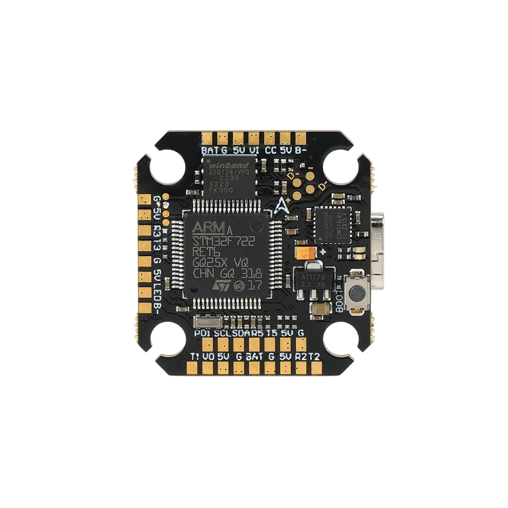 Close front view of the flight controller showing the STM32F722 processor, USB-C connector, boot button, and labeled solder pads.