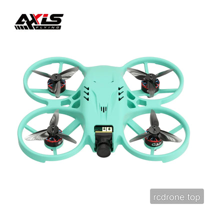 Top-front view of the mint green ducted FPV drone, showing four propellers, protective ducts, and front camera.
