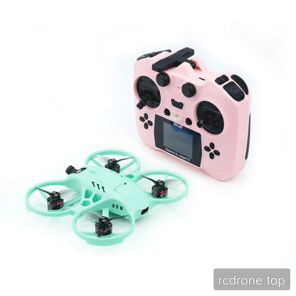 Mint green ducted FPV drone displayed beside a pink radio controller with a screen, switches, and control sticks.