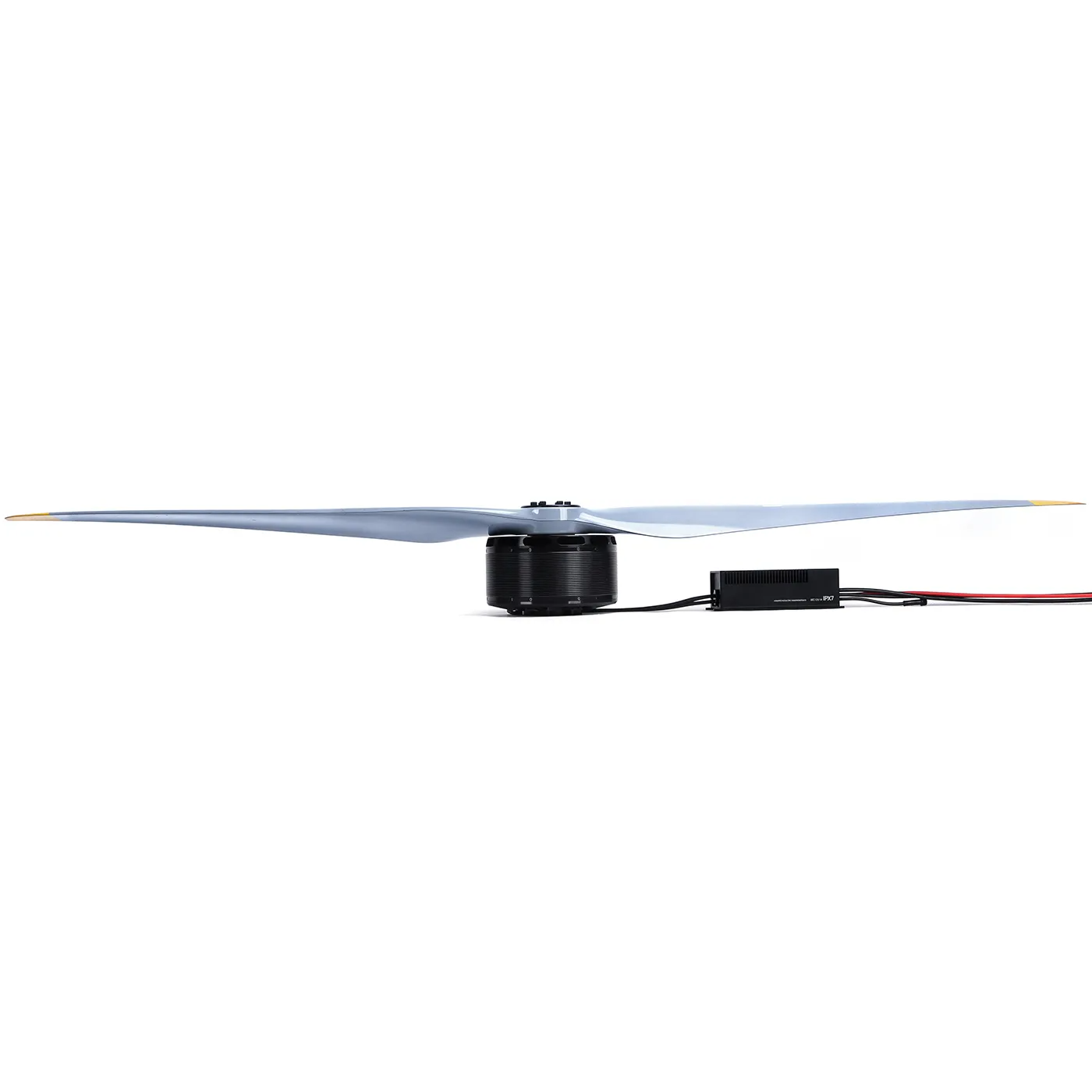 Drone motor with large two-blade propeller and inline ESC module with red and black power leads