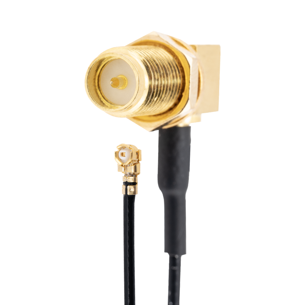 Close-up of right-angle RP-SMA bulkhead connector with attached micro coax pigtail end