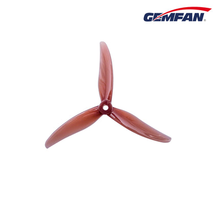 Red translucent Gemfan 3-blade propeller, top view with Gemfan logo