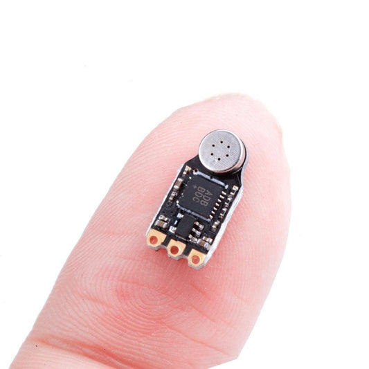 Flywoo AGC-MIC Nano VTX microphone module with metal mic capsule and three solder pads on a tiny PCB