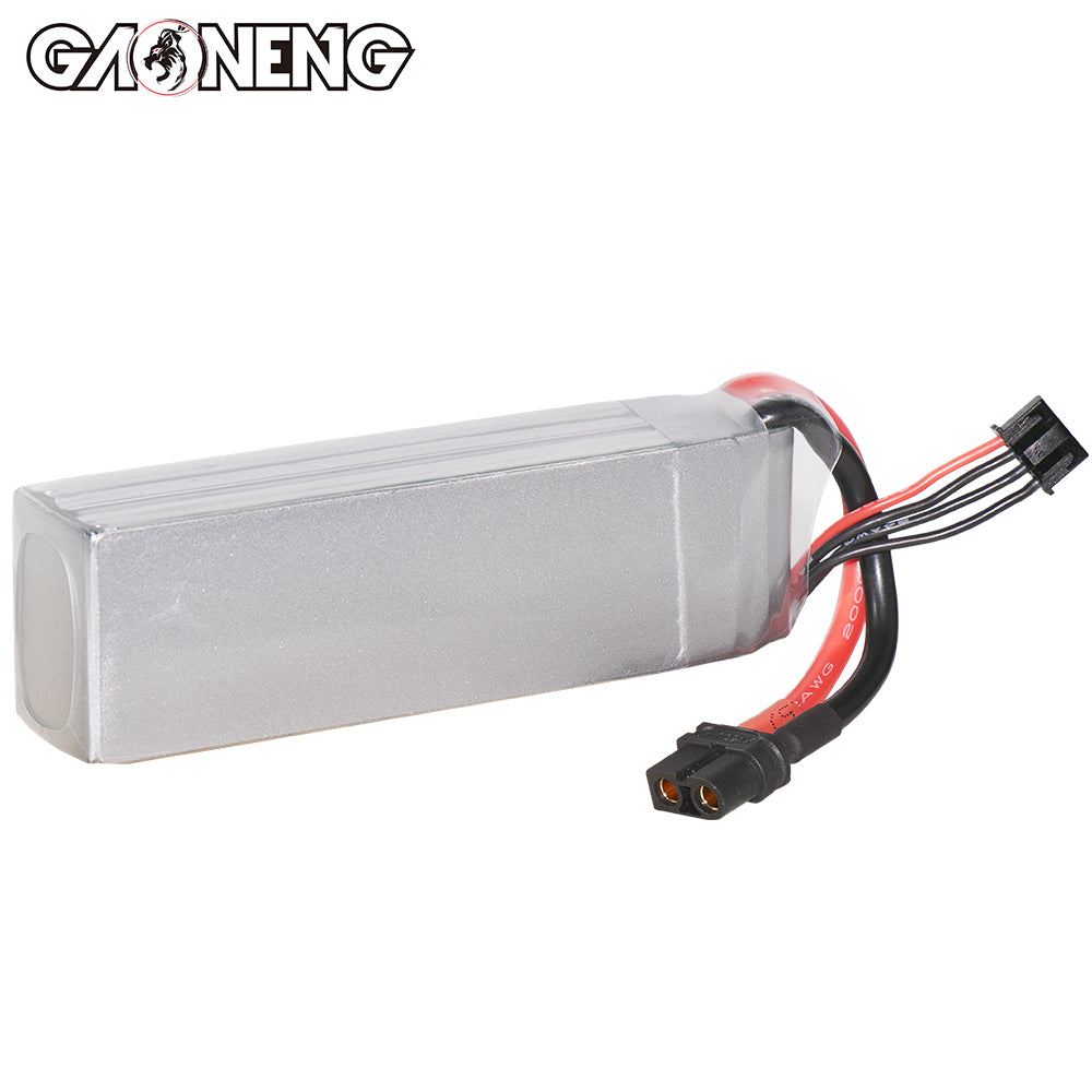Rear view of silver LiPo battery pack showing heat-shrink wrap and attached XT60 leads