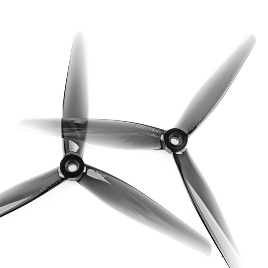 HQProp 7.5x3.7x3 tri-blade propeller pair, close-up of hubs and translucent grey blades
