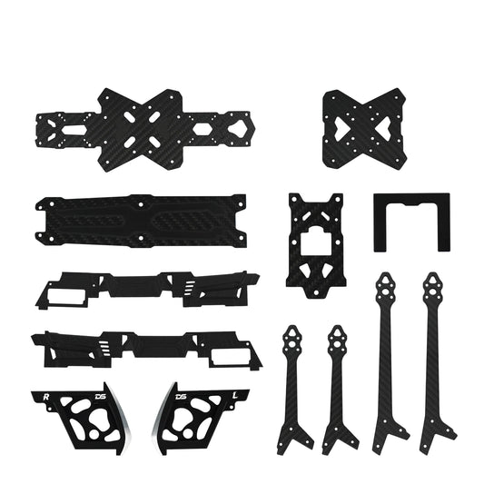 Assorted black carbon-fiber-pattern FPV drone frame plates, arms, side panels, and small mounting pieces.