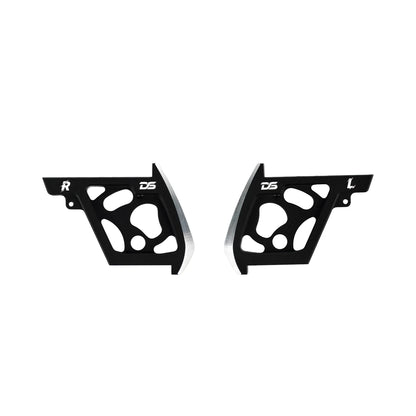 Matched pair of black cutout side panels with silver-colored beveled edges and DS-style markings.