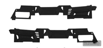 Two slim black molded side pieces with rectangular openings, angled cutouts, and textured surface details.