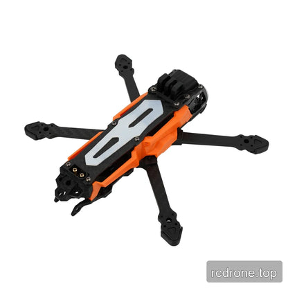 DeepSpace SEEKER35 FPV frame in orange and black, shown from an elevated front-right angle with exposed carbon-fiber arms.