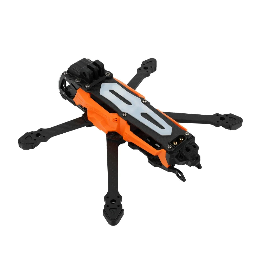 DeepSpace SEEKER35 FPV frame in orange and black, shown from an elevated rear-right angle with carbon-fiber arms.