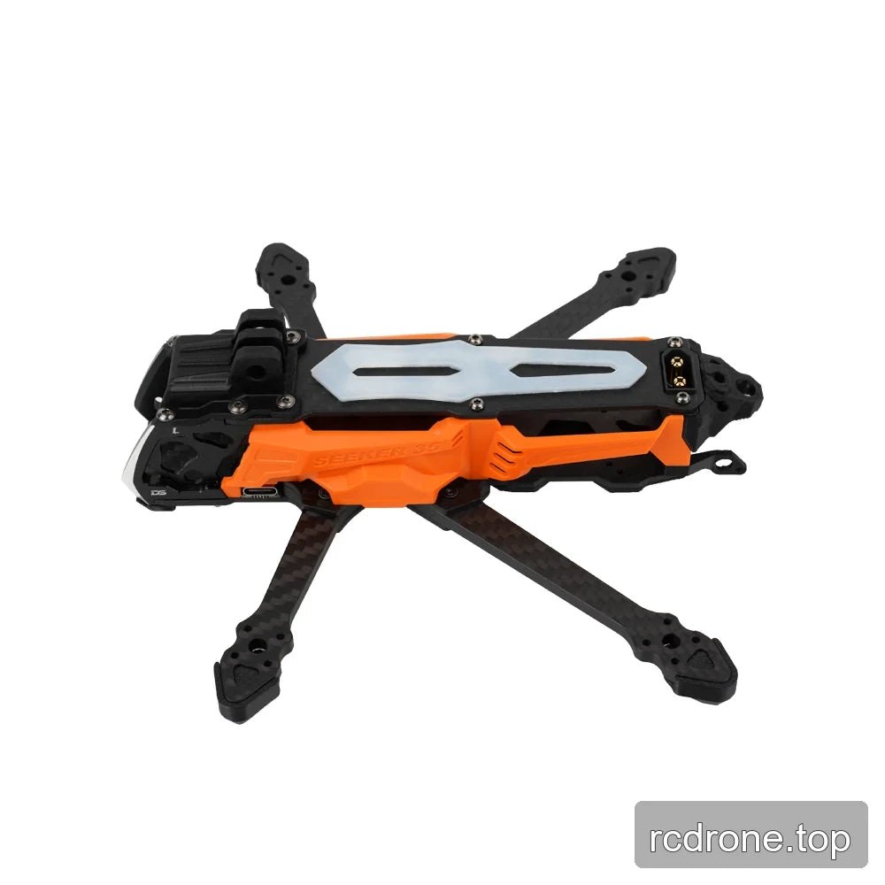 Orange and black DeepSpace SEEKER35 FPV frame in side profile, with a pale slotted top plate and carbon-fiber arms.