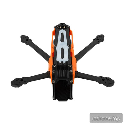Top-down view of the orange and black DeepSpace SEEKER35 FPV frame, showing the pale slotted top plate and four arms.