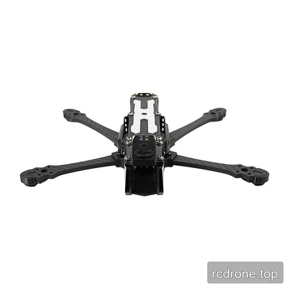 DeepSpace SEEKER5 carbon-fiber FPV frame kit viewed head-on, showing the front camera cage, top plate, and motor arms.